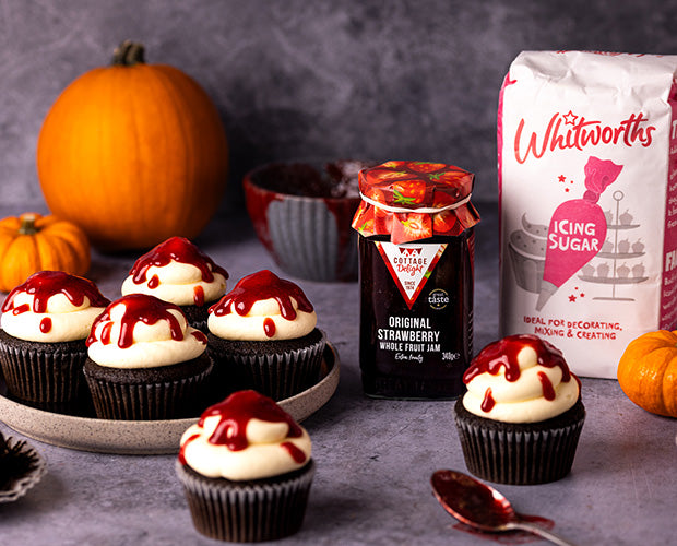 Halloween black cupcakes decorated with red jam