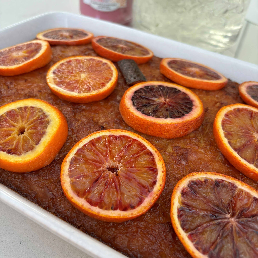 A cake made with filo pastry drenched in a zesty orange syrup, topped with candied blood oranges