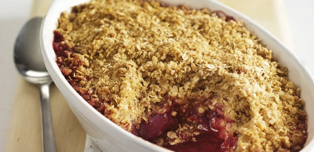 Pear and raspberry oat crumble in a dish