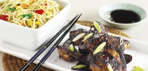 a plate of sticky chicken teriyaki and noodles