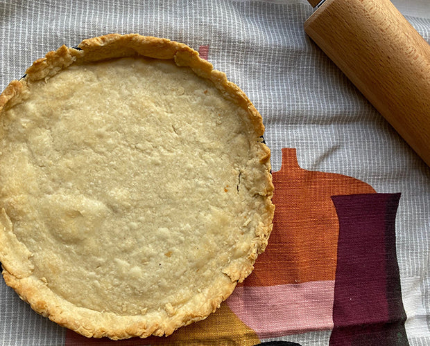 a shortcrust pastry displayed on a tea towel