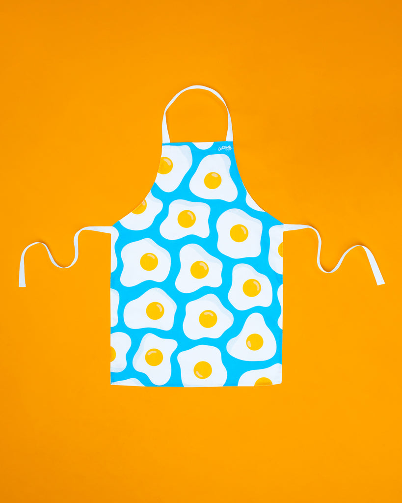 Flat lay of Whitworths Blue Sunny Egg design apron