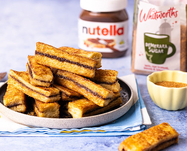 Toast fried in the panned and layered with Nutella, Cinnamon and Demerara sugar 