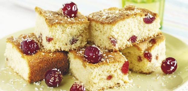 A plat of coconut and cherry tray bake