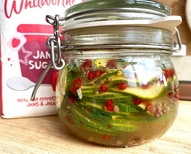 A jar filled with courgette pickle