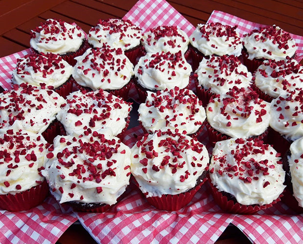 a plate full of red velvet cupcakes