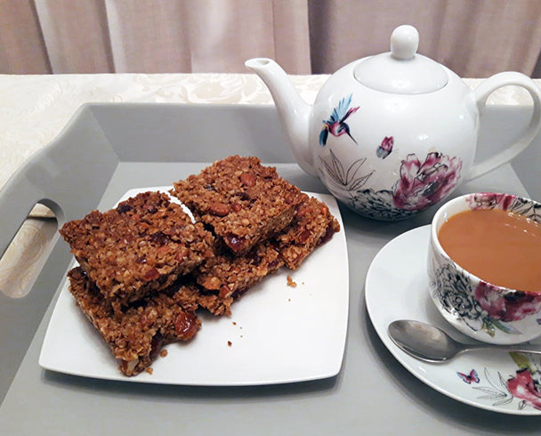 Vegan flapjack slices on a plate, served with tea 