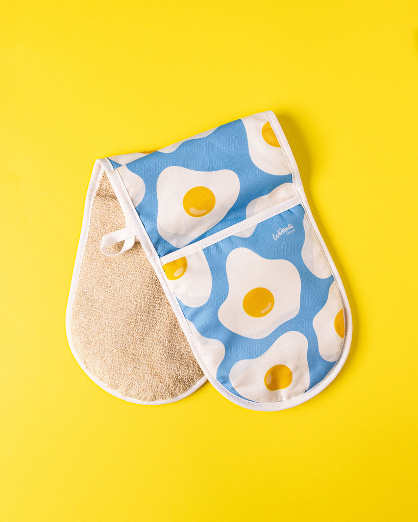 Flat lay of Whitworths Blue Sunny Egg oven glove 