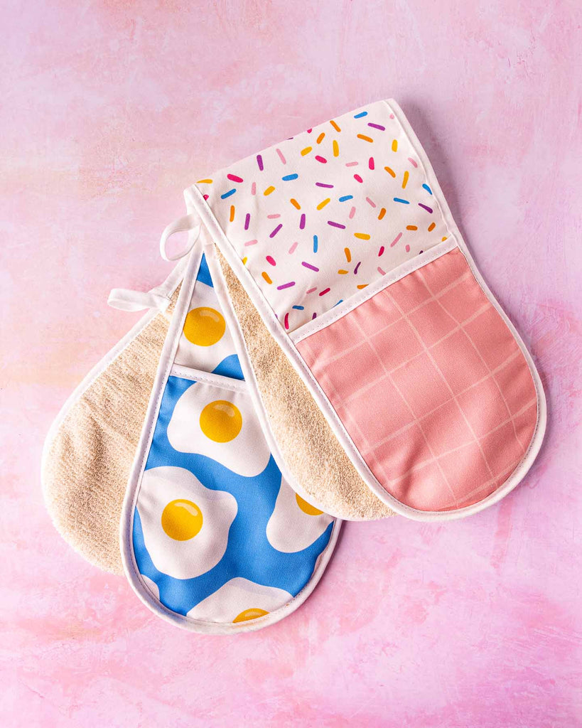 Flat lays of Blue Sunny Egg and Sprinkles Double oven gloves 