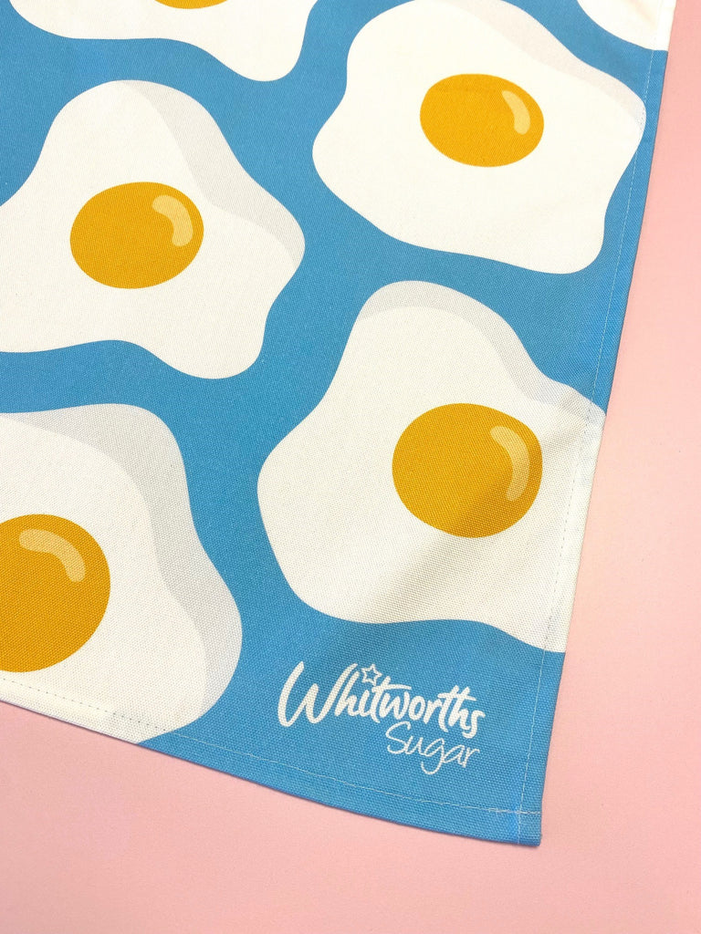 Close up of blue sunny egg tea towel