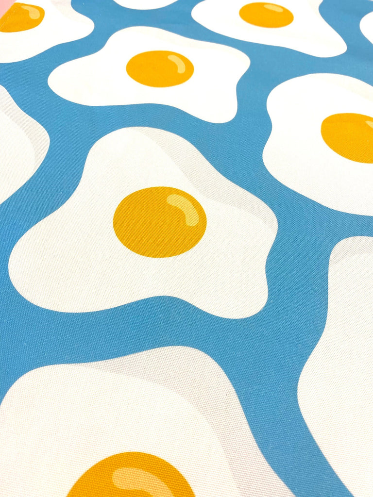 Close up of blue sunny egg print