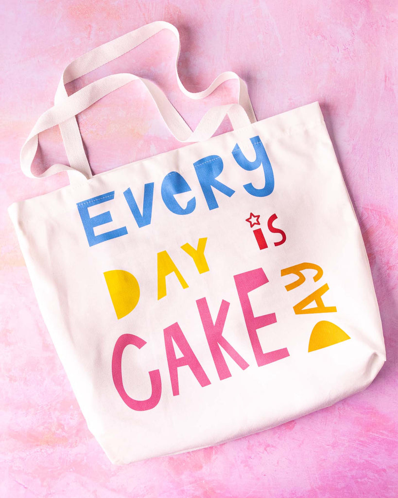 Flat lay image of Everyday is cake day tote bag